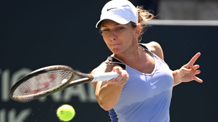 Simona Halep plays a shot against Jil Teichmann.